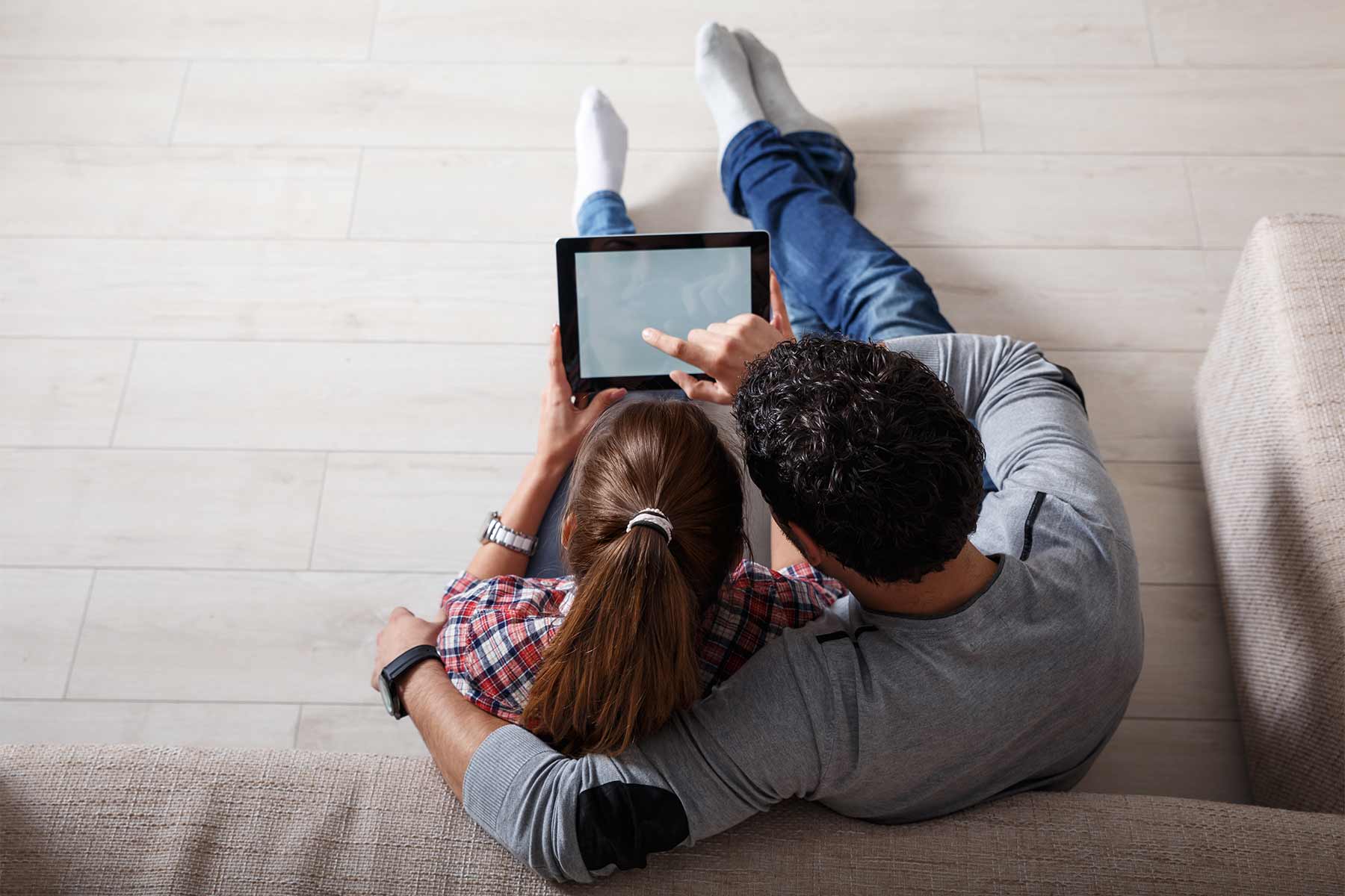 Young couple scheduling their home inspection online